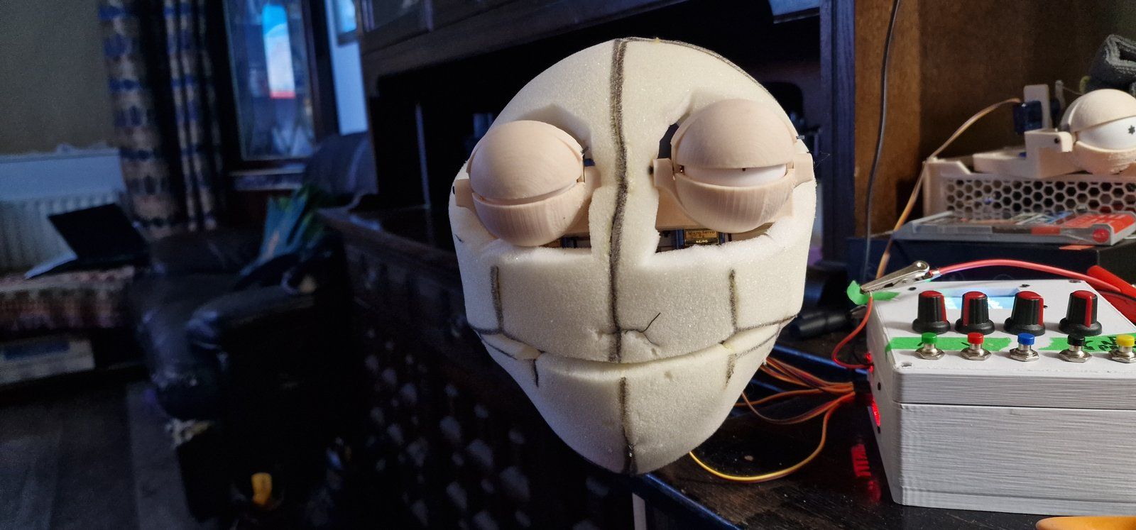 The mirrored eye and eyelid mechanism being calibrated