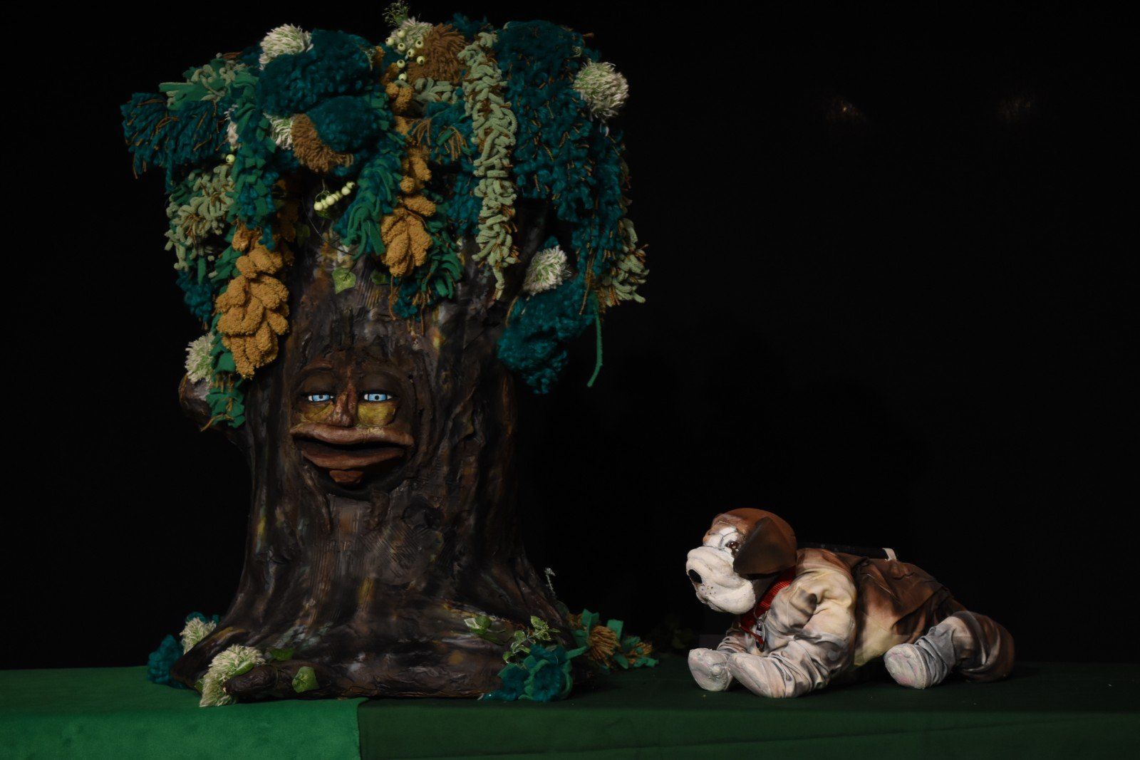 On stage with a dog puppet.